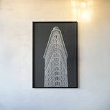 Flatiron Building on Black by Wild Apple Portfolio. shown as a paper print in a black flame. Available as a archival giclee rolled canvas, fine art paper, or poster print. SKU 68473h.
