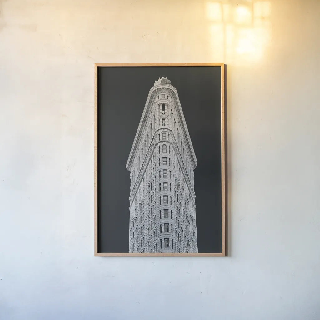 Flatiron Building on Black by Wild Apple Portfolio. shown as a paper print in a natural frame. Available as a archival giclee rolled canvas, fine art paper, or poster print. SKU 68473h.