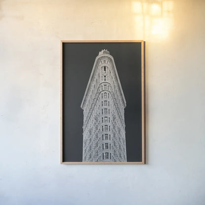 Flatiron Building on Black by Wild Apple Portfolio. shown as a paper print in a natural frame. Available as a archival giclee rolled canvas, fine art paper, or poster print. SKU 68473h.