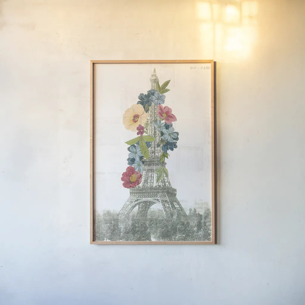 Floral Eiffel Tower by Wild Apple Portfolio. shown as a paper print in a natural frame. Available as a archival giclee rolled canvas, fine art paper, or poster print. SKU 46628h.