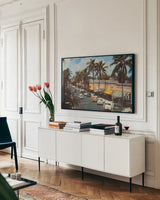 Florida Postcard IV by Wild Apple Portfolio. shown as a framed stretched canvas in a living room above a console. Available as a archival giclee rolled canvas, fine art paper, or poster print. SKU 57481i.