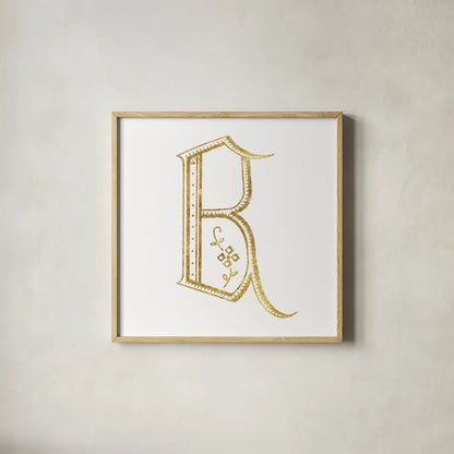French Sewing Letter B by Wild Apple Portfolio. Shown in a natural wood glass frame for a timeless modern aesthetic. Available as an archival giclee rolled canvas, fine art paper, or poster print. SKU 43228a.