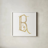 French Sewing Letter B by Wild Apple Portfolio. Shown in a crisp white glass frame for a clean and minimalist style. Available as an archival giclee rolled canvas, fine art paper, or poster print. SKU 43228a.