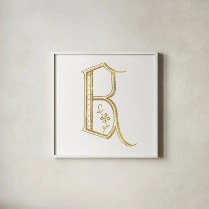 French Sewing Letter B by Wild Apple Portfolio. Shown in a crisp white glass frame for a clean and minimalist style. Available as an archival giclee rolled canvas, fine art paper, or poster print. SKU 43228a.