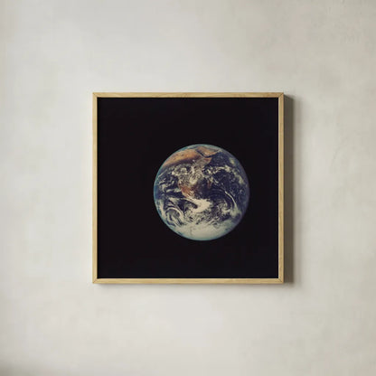 Full Disk Earth by Wild Apple Portfolio. Shown in a natural wood glass frame for a timeless modern aesthetic. Available as an archival giclee rolled canvas, fine art paper, or poster print. SKU 84533a.