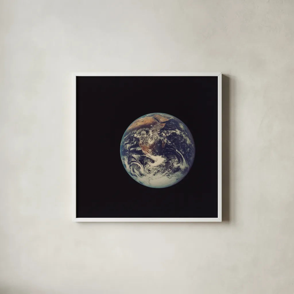 Full Disk Earth by Wild Apple Portfolio. Shown in a crisp white glass frame for a clean and minimalist style. Available as an archival giclee rolled canvas, fine art paper, or poster print. SKU 84533a.
