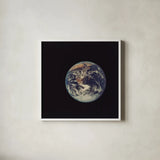 Full Disk Earth by Wild Apple Portfolio. Shown in a crisp white glass frame for a clean and minimalist style. Available as an archival giclee rolled canvas, fine art paper, or poster print. SKU 84533a.