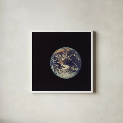 Full Disk Earth by Wild Apple Portfolio. Shown in a crisp white glass frame for a clean and minimalist style. Available as an archival giclee rolled canvas, fine art paper, or poster print. SKU 84533a.