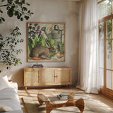 Garden Rabbit I by Wild Apple Portfolio. Shown in a natural wood frame in a cozy modern living room. Available as an archival giclee rolled canvas, fine art paper, or poster print. SKU 45821a.