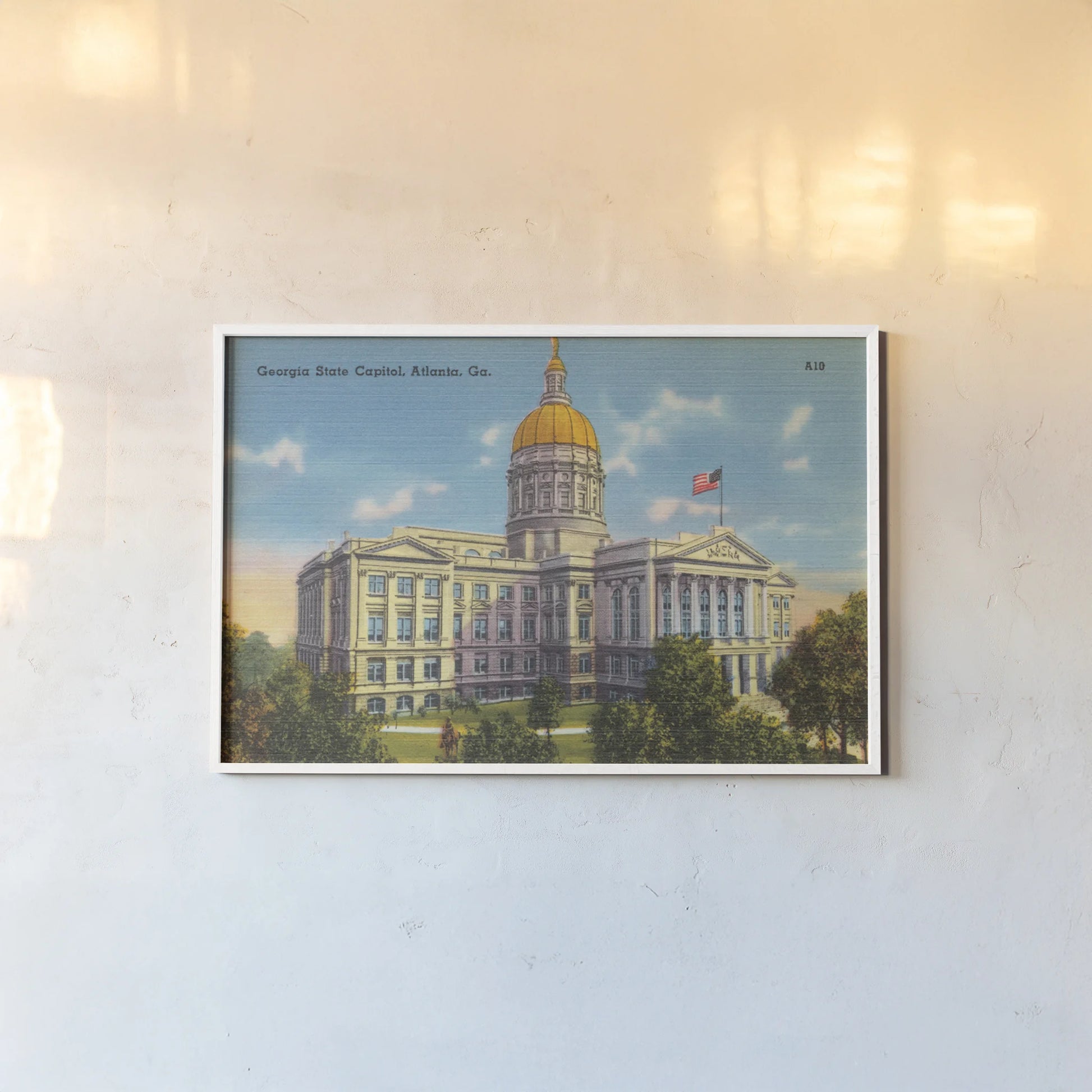 Georgia State Capitol Atlanta by Wild Apple Portfolio. shown as a paper print in a white frame. Available as a archival giclee rolled canvas, fine art paper, or poster print. SKU 101642i.