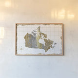Gilded Map Canada by Wild Apple Portfolio. shown as a paper print in a natural frame. Available as a archival giclee rolled canvas, fine art paper, or poster print. SKU 41345i.