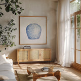 Ginger Jar V on White by Wild Apple Portfolio. Shown in a natural wood frame in a cozy modern living room. Available as an archival giclee rolled canvas, fine art paper, or poster print. SKU 41841a.