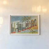 Greetings from Florida v2 by Wild Apple Portfolio. shown as a paper print in a white frame. Available as a archival giclee rolled canvas, fine art paper, or poster print. SKU 45241i.