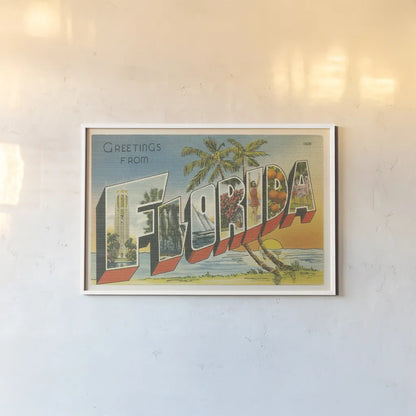Greetings from Florida v2 by Wild Apple Portfolio. shown as a paper print in a white frame. Available as a archival giclee rolled canvas, fine art paper, or poster print. SKU 45241i.