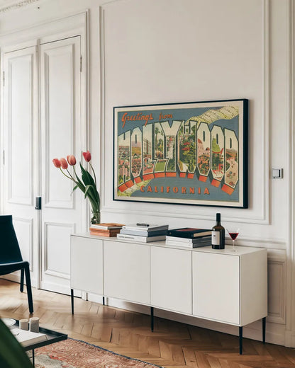 Greetings from Hollywood v2 by Wild Apple Portfolio. shown as a framed stretched canvas in a living room above a console. Available as a archival giclee rolled canvas, fine art paper, or poster print. SKU 45240i.
