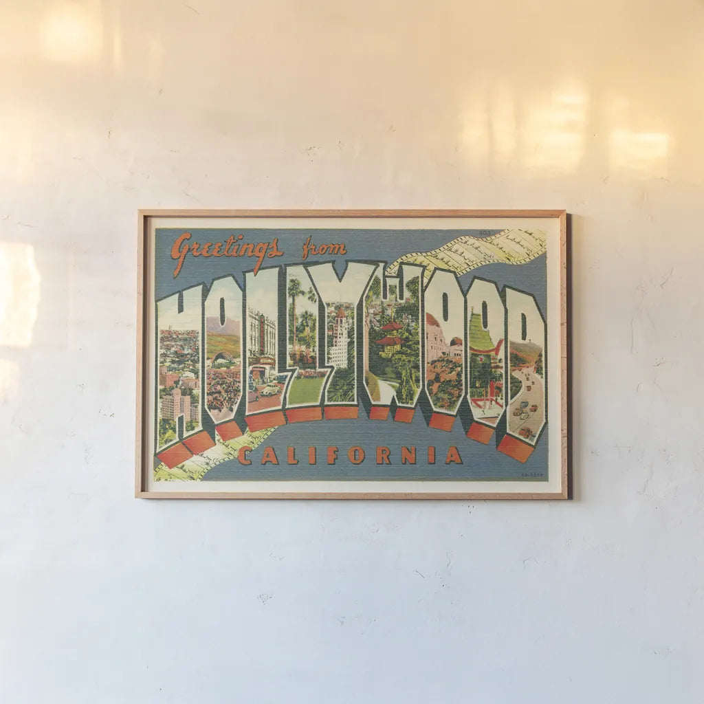 Greetings from Hollywood v2 by Wild Apple Portfolio. shown as a paper print in a natural frame. Available as a archival giclee rolled canvas, fine art paper, or poster print. SKU 45240i.