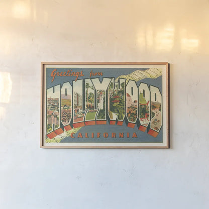 Greetings from Hollywood v2 by Wild Apple Portfolio. shown as a paper print in a natural frame. Available as a archival giclee rolled canvas, fine art paper, or poster print. SKU 45240i.