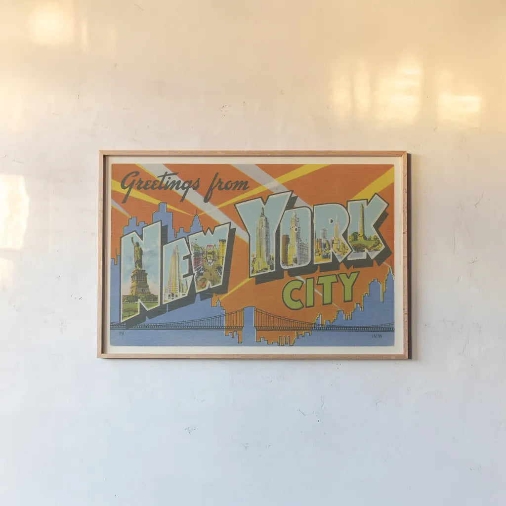 Greetings from New York by Wild Apple Portfolio. shown as a paper print in a natural frame. Available as a archival giclee rolled canvas, fine art paper, or poster print. SKU 45242i.