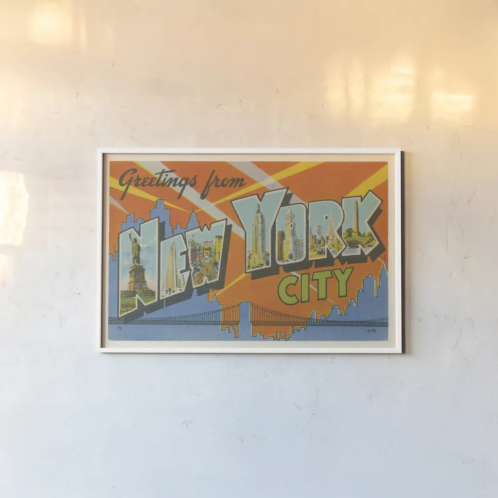 Greetings from New York by Wild Apple Portfolio. shown as a paper print in a white frame. Available as a archival giclee rolled canvas, fine art paper, or poster print. SKU 45242i.