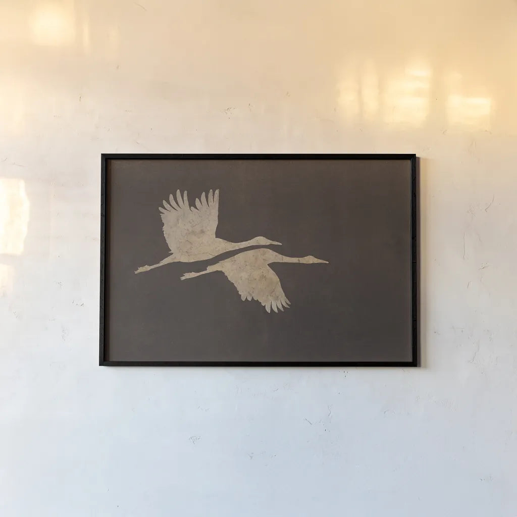Herons in Flight Mocha by Wild Apple Portfolio. shown as a paper print in a black flame. Available as a archival giclee rolled canvas, fine art paper, or poster print. SKU 96471i.