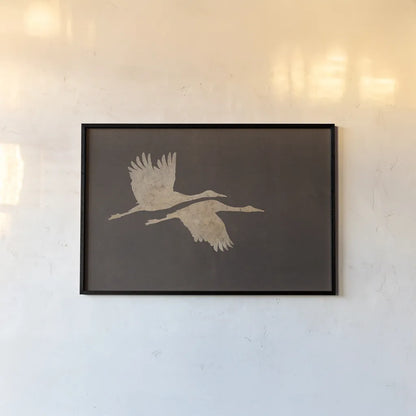 Herons in Flight Mocha by Wild Apple Portfolio. shown as a paper print in a black flame. Available as a archival giclee rolled canvas, fine art paper, or poster print. SKU 96471i.