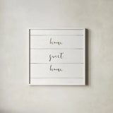 Home Sweet Home I Shiplap by Wild Apple Portfolio. Shown in a crisp white glass frame for a clean and minimalist style. Available as an archival giclee rolled canvas, fine art paper, or poster print. SKU 48926a.