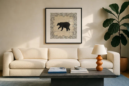 In the Woods Bear by Wild Apple Portfolio. Displayed in a glass frame with matte in a clean modern living room. Available as an archival giclee rolled canvas, fine art paper, or poster print. SKU 19667a.