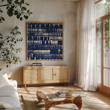 Indigo Batik IV by Wild Apple Portfolio. Shown in a natural wood frame in a cozy modern living room. Available as an archival giclee rolled canvas, fine art paper, or poster print. SKU 16451a.