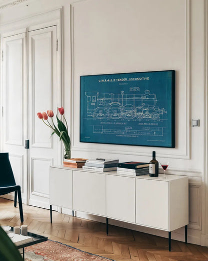 Locomotive Blueprint I by Wild Apple Portfolio. shown as a framed stretched canvas in a living room above a console. Available as a archival giclee rolled canvas, fine art paper, or poster print. SKU 53885i.