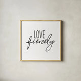 Love Fiercely by Wild Apple Portfolio. Shown in a natural wood glass frame for a timeless modern aesthetic. Available as an archival giclee rolled canvas, fine art paper, or poster print. SKU 59256a.