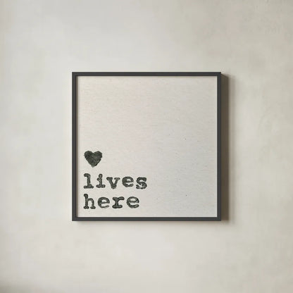 Love Lives Here by Wild Apple Portfolio. Shown in a sleek black glass frame for a contemporary gallery look. Available as an archival giclee rolled canvas, fine art paper, or poster print. SKU 71691a.