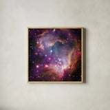 Magellanic Cloud Galaxy by Wild Apple Portfolio. Shown in a natural wood glass frame for a timeless modern aesthetic. Available as an archival giclee rolled canvas, fine art paper, or poster print. SKU 89316a.