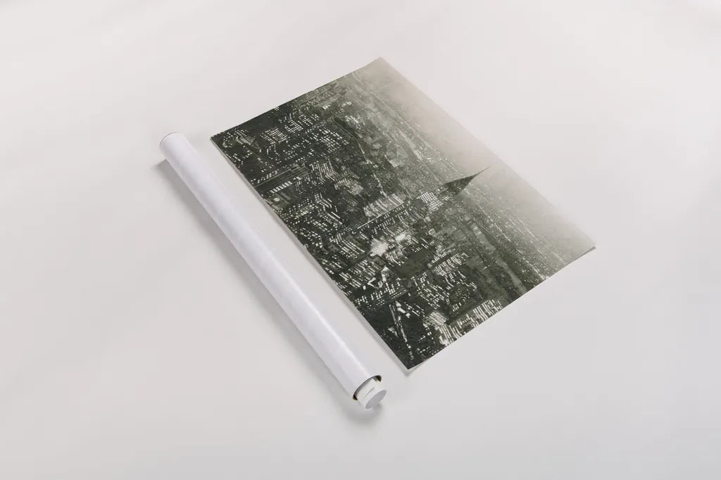 Manhattan at Night by Wild Apple Portfolio. shown as a rolled paper print. Available as archival giclee rolled canvas, fine art paper, or poster print. SKU 46627i.