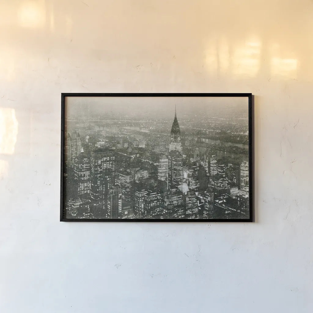 Manhattan at Night by Wild Apple Portfolio. shown as a paper print in a black flame. Available as a archival giclee rolled canvas, fine art paper, or poster print. SKU 46627i.