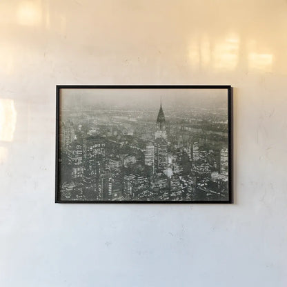 Manhattan at Night by Wild Apple Portfolio. shown as a paper print in a black flame. Available as a archival giclee rolled canvas, fine art paper, or poster print. SKU 46627i.