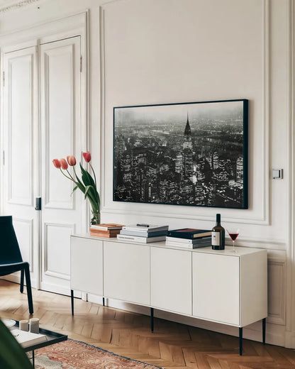 Manhattan at Night Rich Black by Wild Apple Portfolio. shown as a framed stretched canvas in a living room above a console. Available as a archival giclee rolled canvas, fine art paper, or poster print. SKU 64605i.