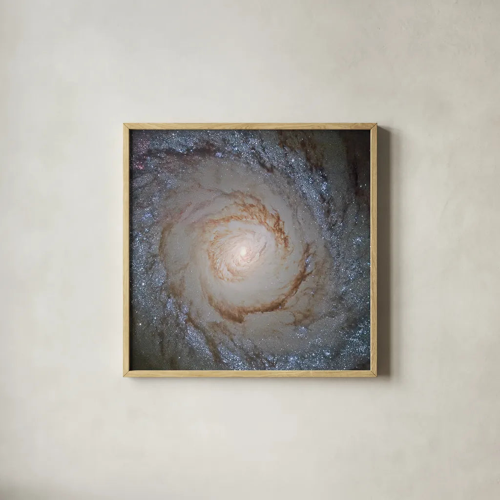 Messier Galaxy by Wild Apple Portfolio. Shown in a natural wood glass frame for a timeless modern aesthetic. Available as an archival giclee rolled canvas, fine art paper, or poster print. SKU 89317a.