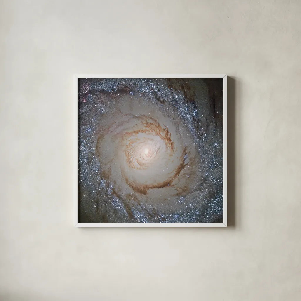 Messier Galaxy by Wild Apple Portfolio. Shown in a crisp white glass frame for a clean and minimalist style. Available as an archival giclee rolled canvas, fine art paper, or poster print. SKU 89317a.