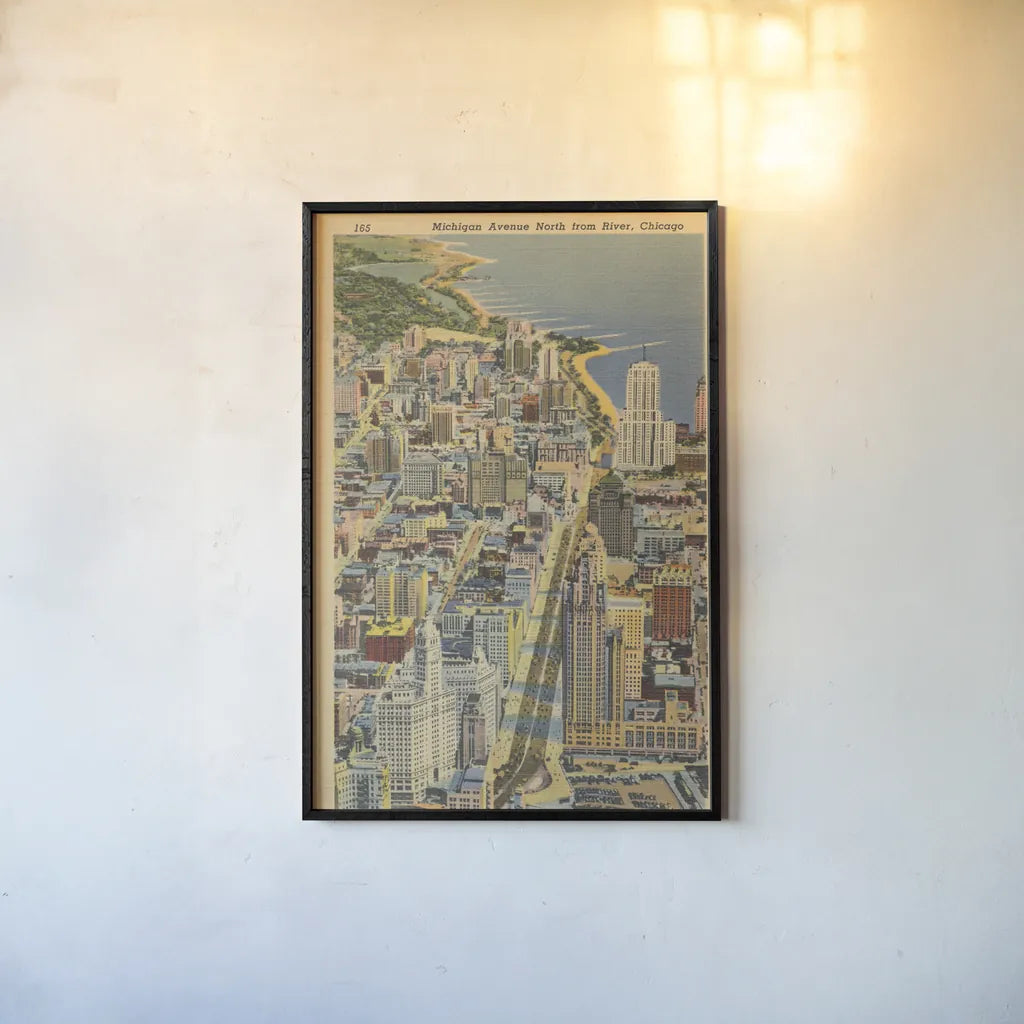 Michigan Avenue North from River Chicago by Wild Apple Portfolio. shown as a paper print in a black flame. Available as a archival giclee rolled canvas, fine art paper, or poster print. SKU 68512h.