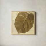Monstera Leaf I by Wild Apple Portfolio. Shown in a natural wood glass frame for a timeless modern aesthetic. Available as an archival giclee rolled canvas, fine art paper, or poster print. SKU 37205a.