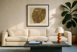 Monstera Leaf I by Wild Apple Portfolio. Displayed in a glass frame with matte in a clean modern living room. Available as an archival giclee rolled canvas, fine art paper, or poster print. SKU 37205a.