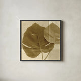 Monstera Leaf II by Wild Apple Portfolio. Shown in a sleek black glass frame for a contemporary gallery look. Available as an archival giclee rolled canvas, fine art paper, or poster print. SKU 37204a.