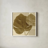 Monstera Leaf II by Wild Apple Portfolio. Shown in a crisp white glass frame for a clean and minimalist style. Available as an archival giclee rolled canvas, fine art paper, or poster print. SKU 37204a.