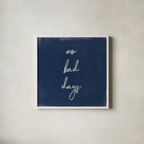 My Home Inspiration II Indigo by Wild Apple Portfolio. Shown in a crisp white glass frame for a clean and minimalist style. Available as an archival giclee rolled canvas, fine art paper, or poster print. SKU 80568a.