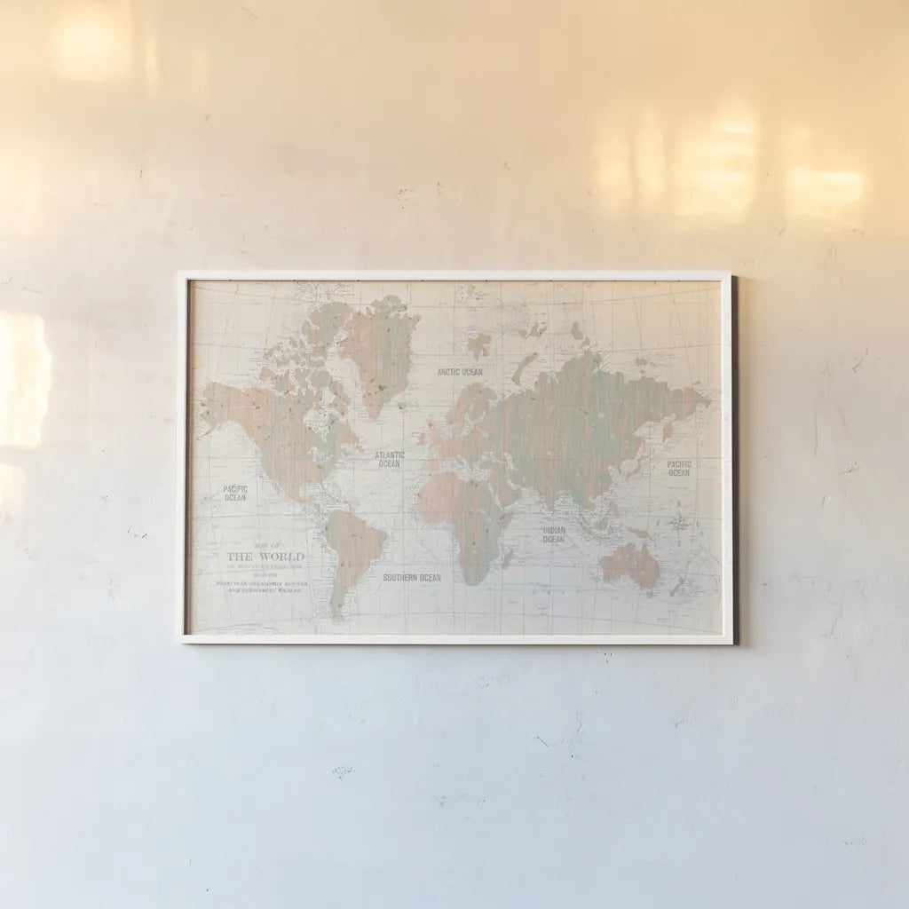 Old World Map Blush and Mint by Wild Apple Portfolio. shown as a paper print in a white frame. Available as a archival giclee rolled canvas, fine art paper, or poster print. SKU 41810i.