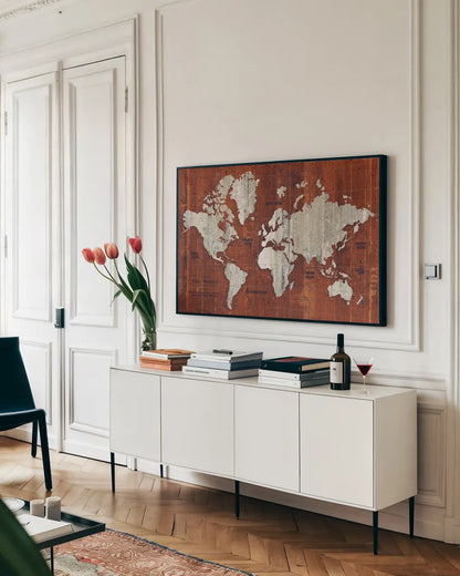 Old World Map Rust by Wild Apple Portfolio. shown as a framed stretched canvas in a living room above a console. Available as a archival giclee rolled canvas, fine art paper, or poster print. SKU 69974i.