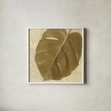 Ornate Monstera Leaf I by Wild Apple Portfolio. Shown in a crisp white glass frame for a clean and minimalist style. Available as an archival giclee rolled canvas, fine art paper, or poster print. SKU 37203a.
