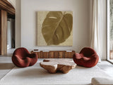 Ornate Monstera Leaf I by Wild Apple Portfolio. Shown as extra-large giant wall art in a modern living room. Available as an archival giclee rolled canvas, fine art paper, or poster print. SKU 37203a.