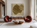 Ornate Monstera Leaf II by Wild Apple Portfolio. Shown as extra-large giant wall art in a modern living room. Available as an archival giclee rolled canvas, fine art paper, or poster print. SKU 37202a.