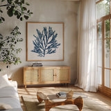 Pacific Sea Mosses Blue on White I by Wild Apple Portfolio. Shown in a natural wood frame in a cozy modern living room. Available as an archival giclee rolled canvas, fine art paper, or poster print. SKU 53891a.